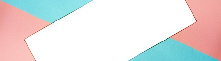 Multicolored paper background with trendy coral color of the year 2019 and a white isolated place...