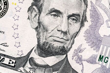 Close-up portrait of Abraham Lincoln on a 5 US dollars banknote.の写真素材