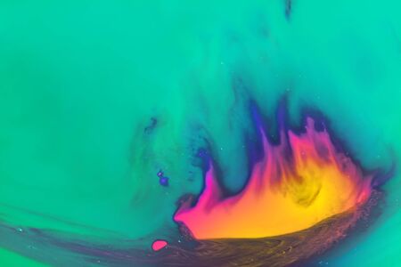 Creative abstraction in the 2020 color trend in yellow, orange and pink colors on an azure backgroundの写真素材