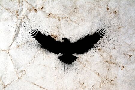 Black silhouette of a flying eagle with spread wings with paint splashes, splatters and blots on an old grunge vintage paper texture background.の写真素材