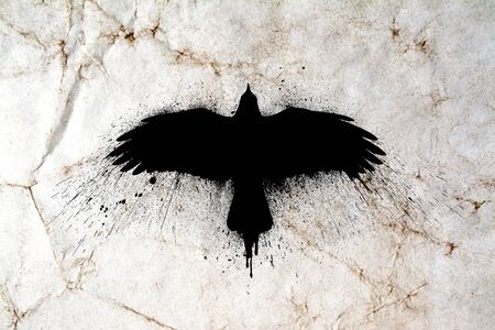 Silhouette of a flying raven with spread wings with paint splashes, splatters and blots on an old grunge vintage paper texture background.の写真素材