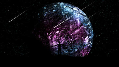 A man at night outdoors with his hands apart, raised to the air against the background of the starry sky with spaceships and a beautiful glowing planet.の写真素材