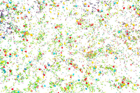 Bright background of multi-colored sweet sprinkles of different shapes in the form of hearts, stars,...