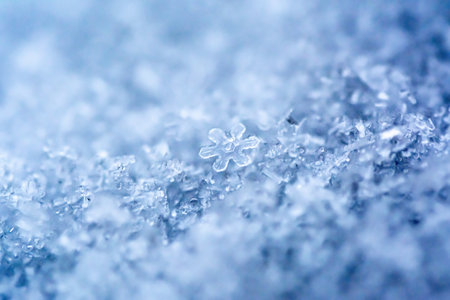 Extreme macro photo of a snowflake. Natural snow texture. Macro texture of snow, snowflakes.の写真素材