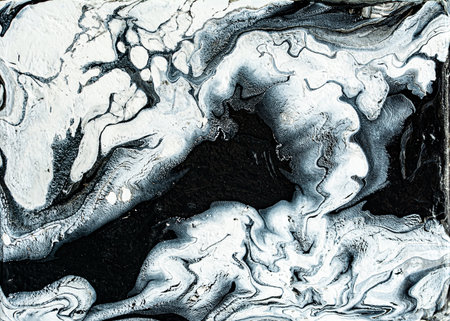 Beautiful black and white marble texture. Abstract background of flowing black and white paint with...