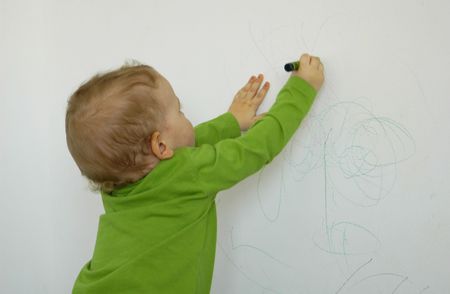 Little child drawing on the wall, conceptual issues
