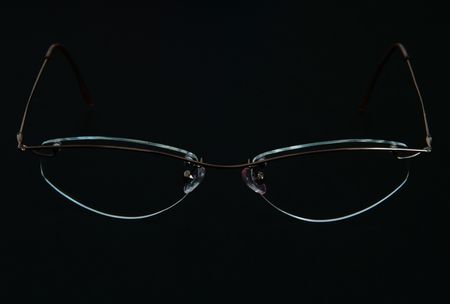 Glasses on the black background, fashion, luxury, optic, eye care issues, metaphorsの写真素材