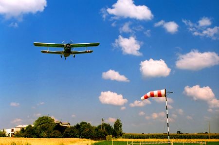 Airplane flying, biplane, windsock, sport, passion, leisure, travel, transportation, safety, mataphorsの写真素材