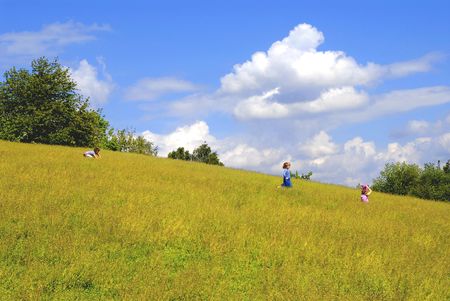 Kids playing on the meadow, childhood, fun, season, nature, leisure, allergy issues, concept の写真素材