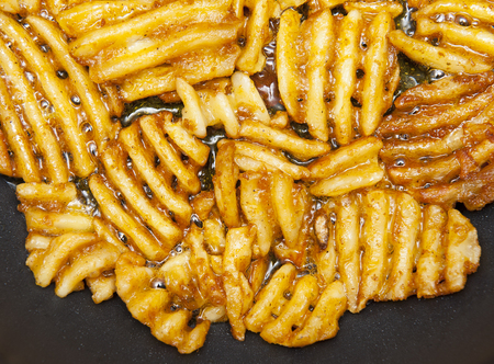 Potato lattices on the black backgroundの写真素材