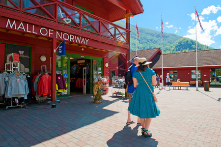 FLAM, NORWAY - JULY 16, 2018: Breathtaking Norwegian fjord and mountain landscapes on Norway in a Nutshell Tour. The Mall of Norway, Shop Tax Free in Flam.のeditorial素材