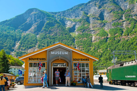 FLAM, NORWAY - JULY 16, 2018: Breathtaking Norwegian fjord and mountain landscapes on Norway in a Nutshell Tour. The Flam Railway Museum and The Flam Railway The Flamsbana locomotive in Flam.のeditorial素材
