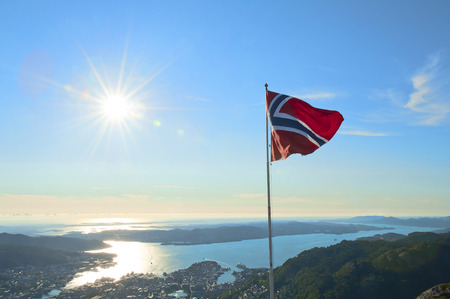 Beautiful view with Norwegian flag seen from the top of Mount Ulriken in Bergen, Norwayの写真素材