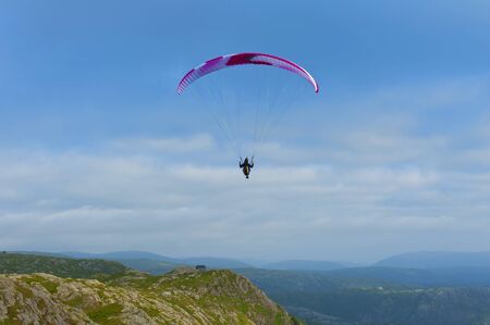 Beautiful landscape with paraglider seen from the Mount Ulriken in Bergen, Norway, on August 4 2019の写真素材