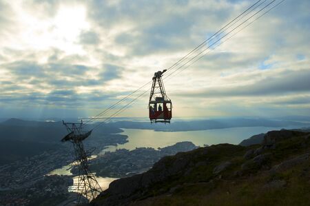 Beautiful view with Ulriken Cable Car and sunset seen from the Mount Ulriken in Bergen, Norway, on August 4 2019の写真素材