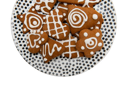 Gingerbreads on the plate isolated the white backgroundの写真素材