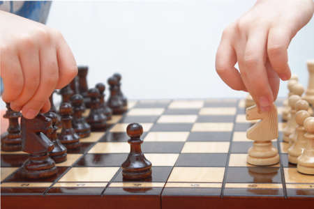 Children playing chessの写真素材