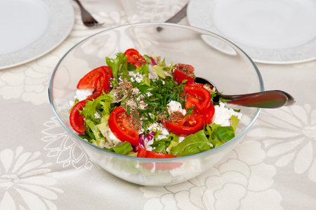 Fresh salad in glass bowlの写真素材
