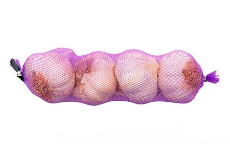 Four heads of garlic isolated on the white backgroundの写真素材
