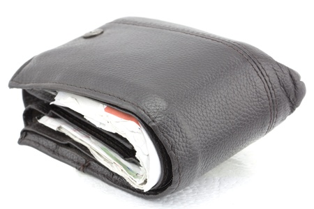 Dark brown wallet full with cradit slipsの写真素材