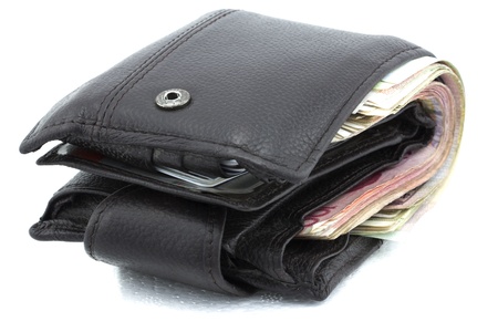 Dark brown wallet full with moneyの写真素材