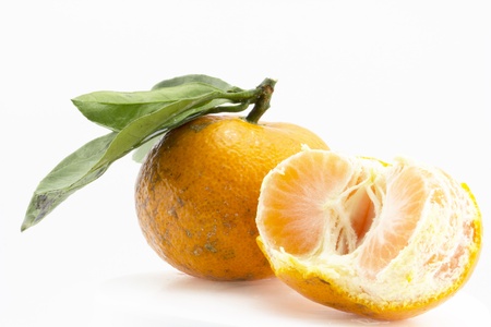 Orange with leaf isolated on isolated white backgroundの写真素材