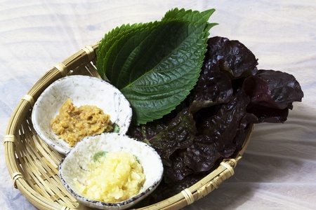 Korean appetizer-eating with Raw fishの写真素材