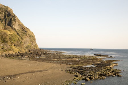 Mountian and sea with clear blue sky background at Jeju Island, South Koreaの写真素材