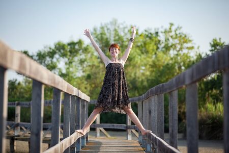 FREEDOM, HAPPY WOMAN ON A GATEWAYの写真素材