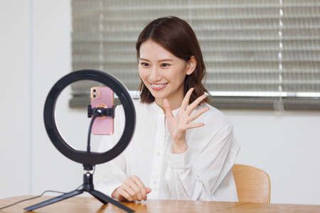 Young Asian woman live streamingの写真素材