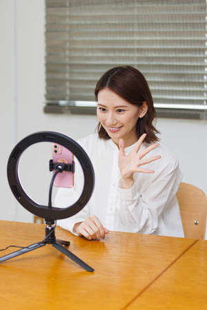 Young Asian woman live streamingの写真素材
