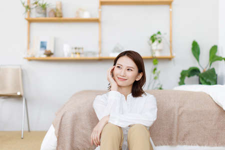 Young Asian woman relaxing at home