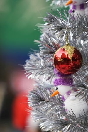 The christmas ornament with the christmas tree.
