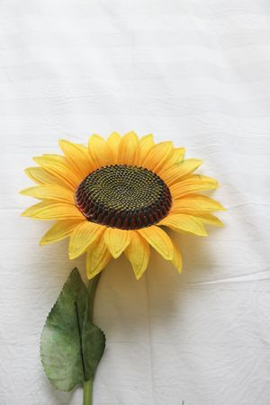 the isolated plastic sunflower ont the white background.の写真素材