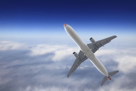 the airplane on  the blue sky background.