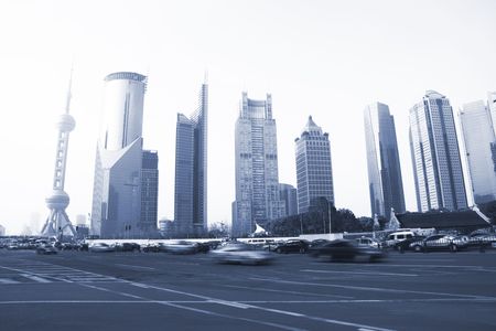 the airplene voyageing through the modern buildings of the lujiazui financial centre in shanghai...