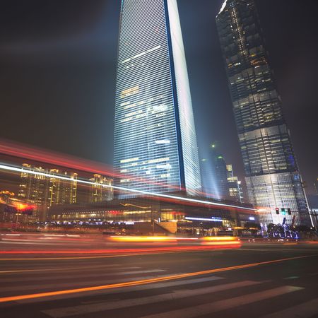 the light trails on the modern building background in shanghai china.の写真素材