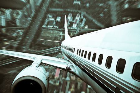 the airplane away from the city,abstract background