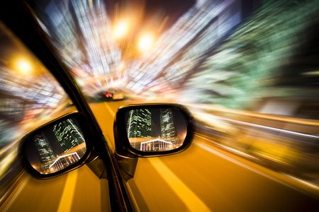 car on the road wiht motion blur background in night.の写真素材