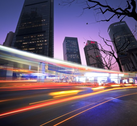 the light trails on the modern building background in shanghai china.の写真素材