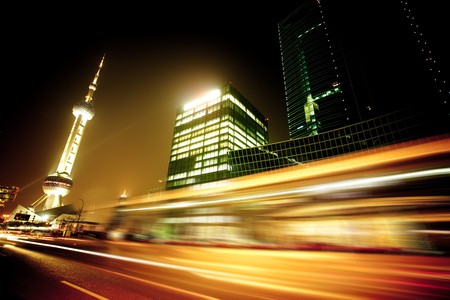 the light trails on the modern building background in shanghai china.のeditorial素材