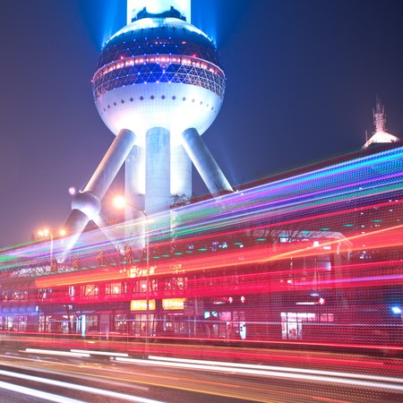 the light trails on the modern building background in shanghai china.のeditorial素材