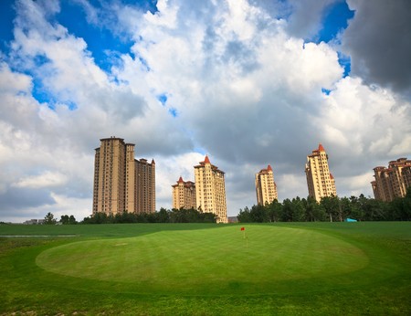 field of grass with the modern building background.の写真素材
