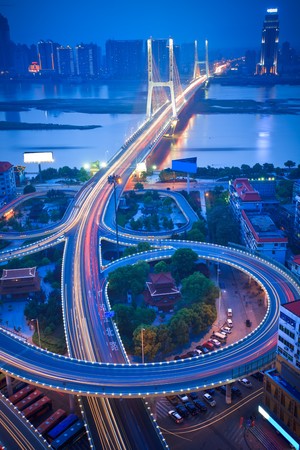 night view of the bridge and city in shanghai china.の写真素材