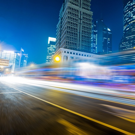 the light trails on the modern building background in shanghai china.の写真素材