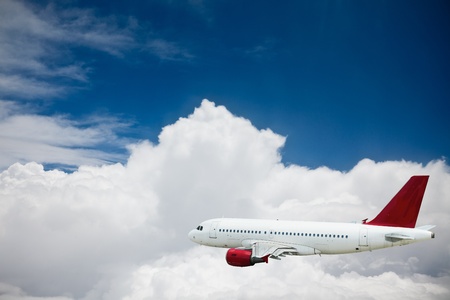 the airplane with the blue sky background.の写真素材
