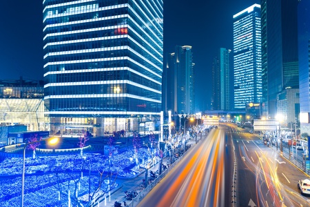 the light trails on the modern building background in shanghai china.の写真素材