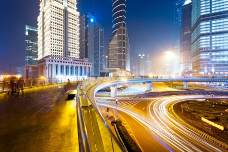 the light trails on the modern building background in shanghai china.
