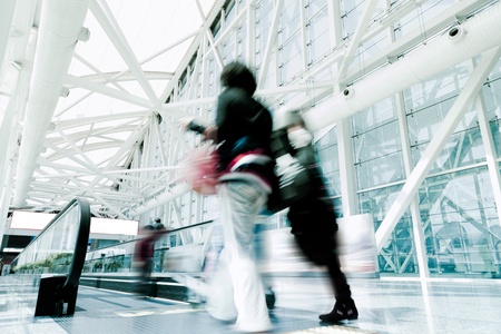 Futuristic guangzhou Airport interiorpeople walking in motion blurの写真素材