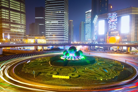 the light trails on the modern building background in shanghai china.の写真素材
